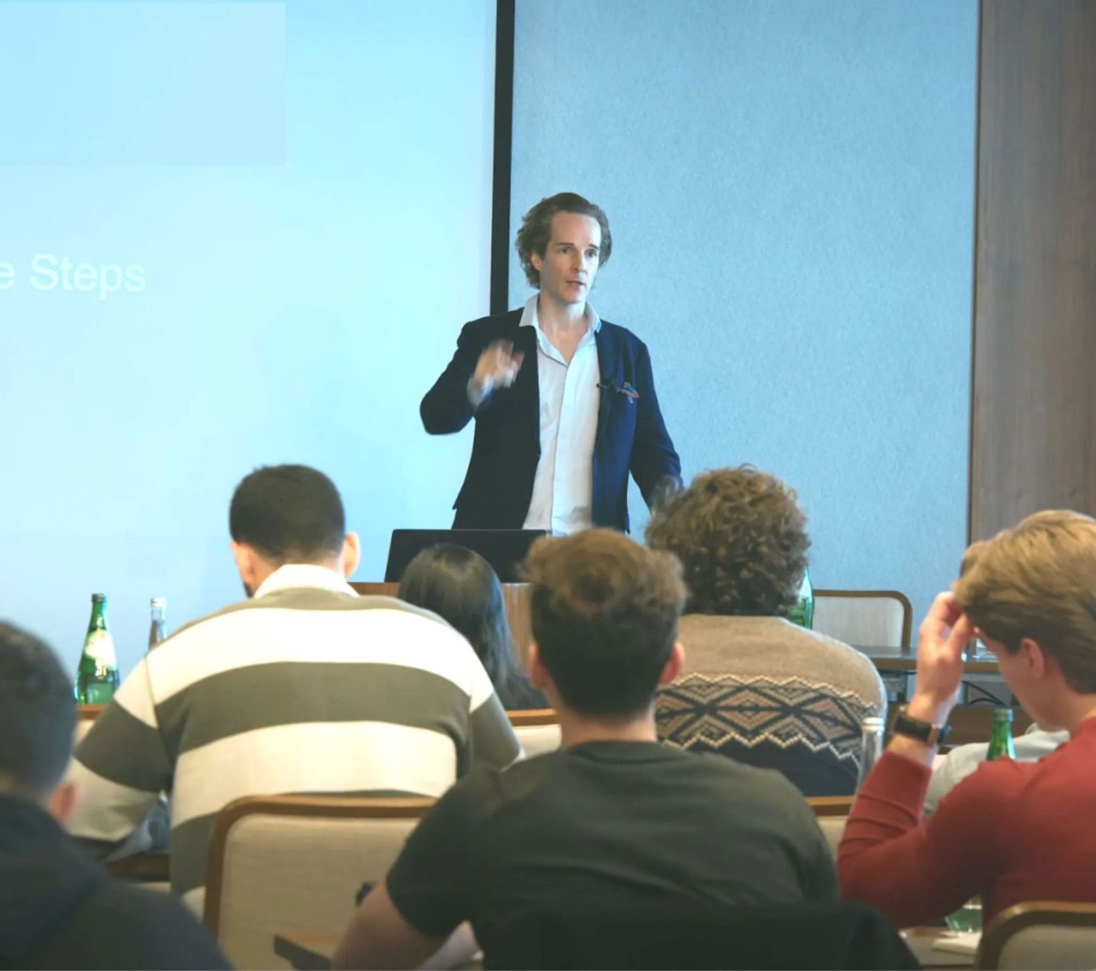 Nikolas Prehn speaking to a seated audience