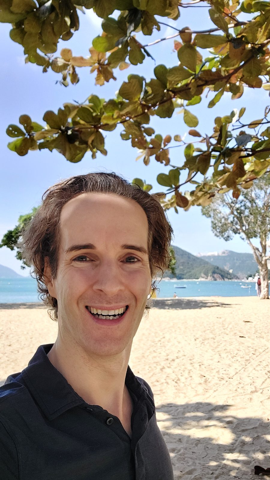 Nikolas Prehn (Felix Nikolas Prehn), on a beach under a tree