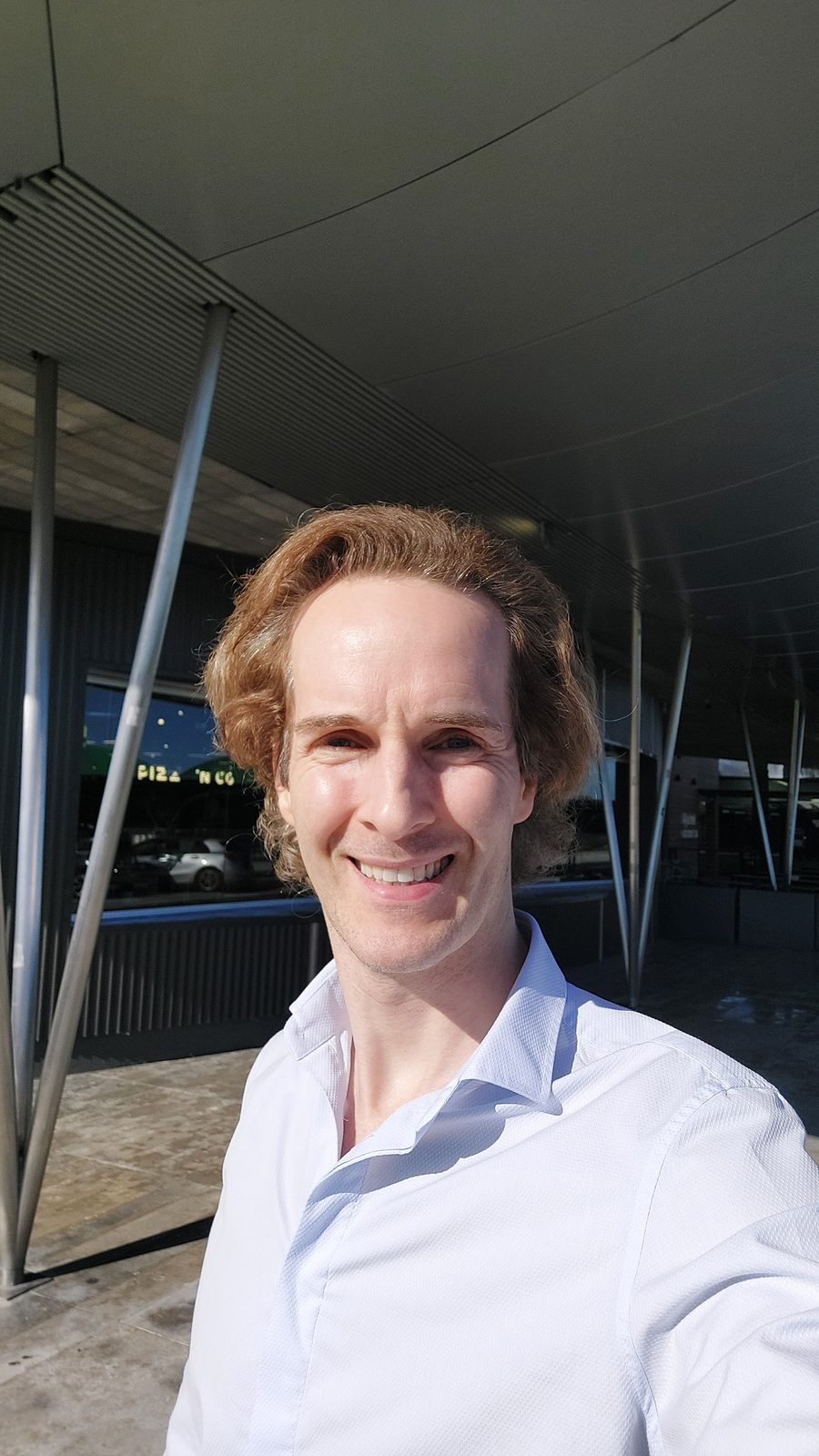 Nikolas Prehn (Felix Nikolas Prehn), in a white shirt under a steel canopy