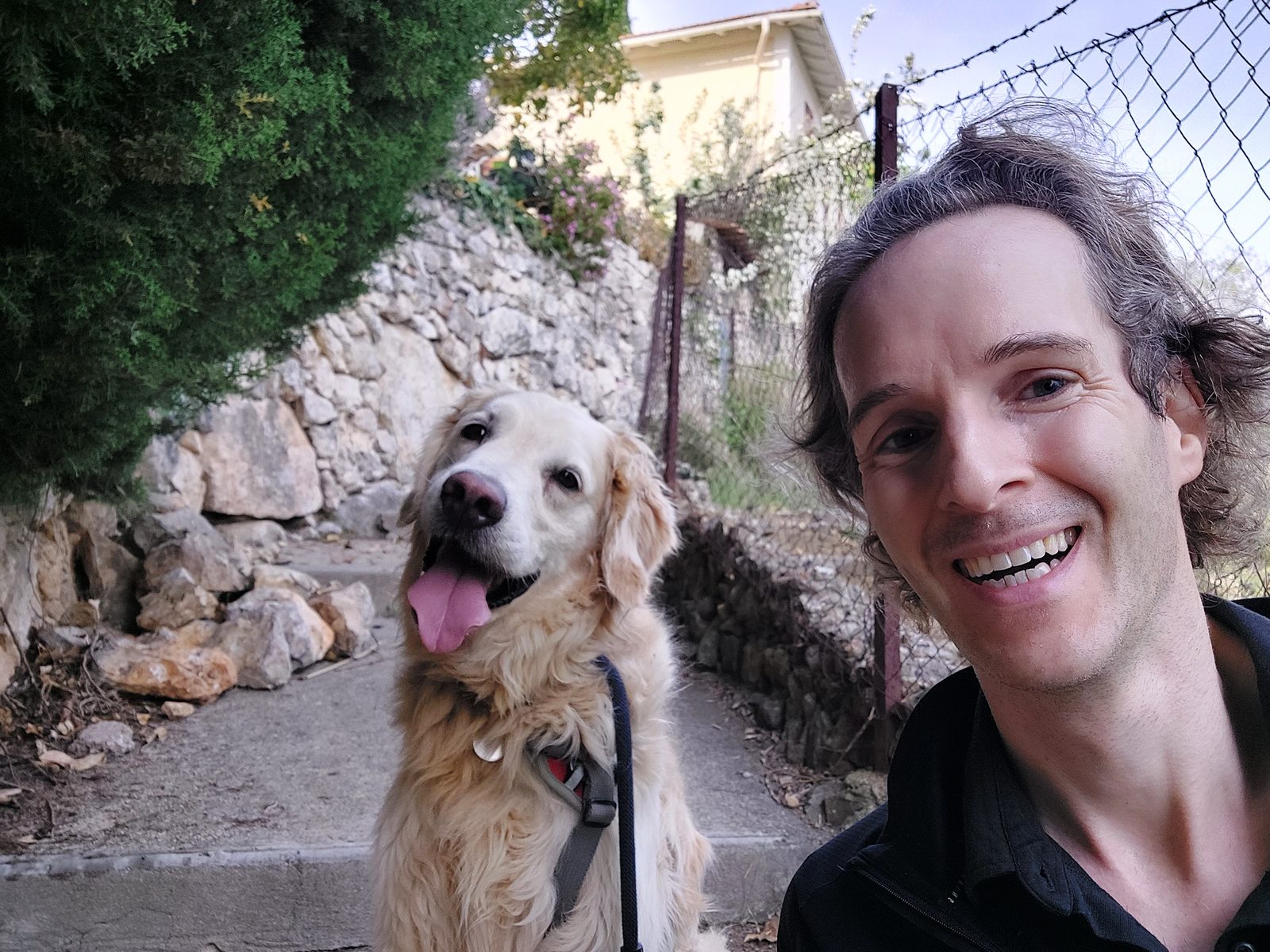 Nikolas Prehn (Felix Nikolas Prehn), with Winston on a stone path